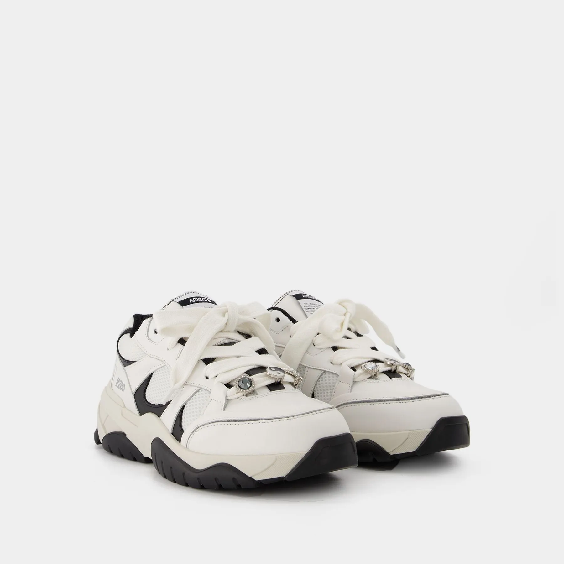 Axel Arigato  Catfish Lo Sneakers in Black and White Leather