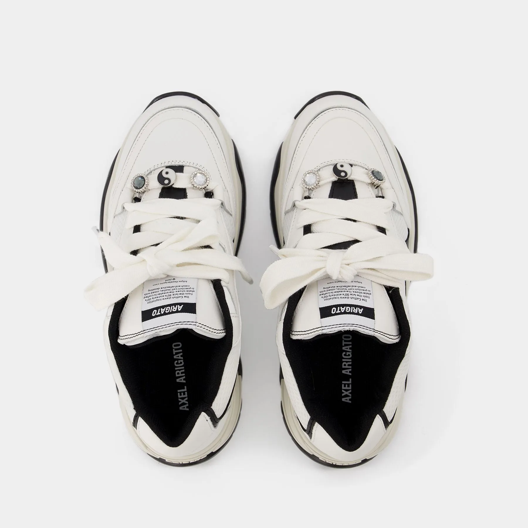 Axel Arigato  Catfish Lo Sneakers in Black and White Leather